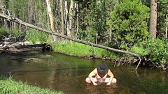 Naked bathing in the creek. Thumb