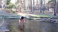 Bathing naked in the creek. Thumb